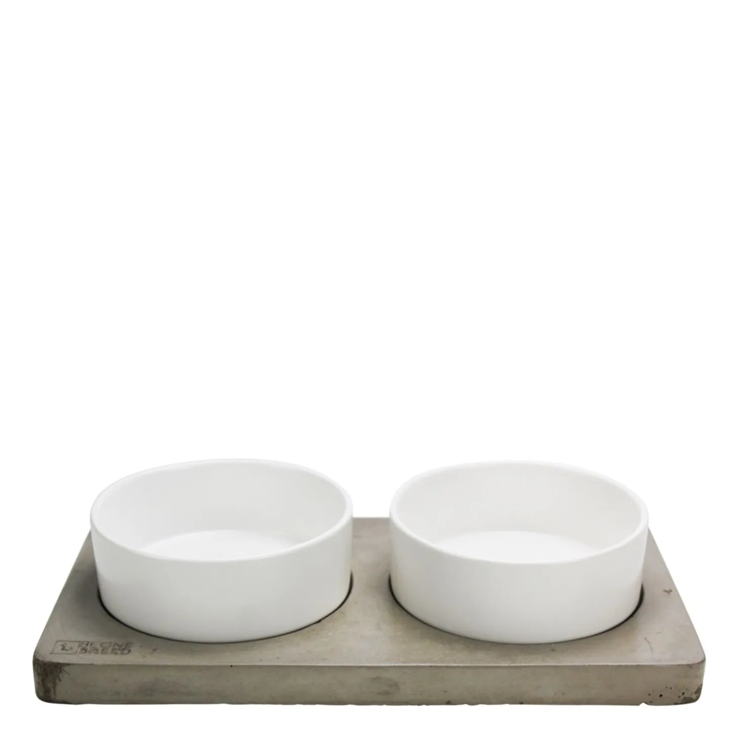 Porcelain bowls on concrete slab
